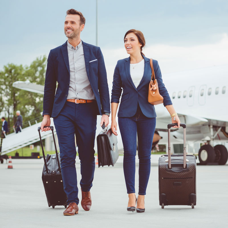 people walking with suitcases
